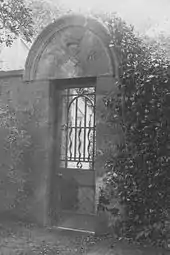 A marriage stone above the door to the Formal Gardens at Robertland House, East Ayrshire. Circa 1930.