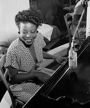 Image 1Mary Lou WilliamsPhotograph credit: William P. Gottlieb; restored by Adam CuerdenMary Lou Williams (May 8, 1910 – May 28, 1981) was an American jazz pianist, arranger, and composer. She wrote hundreds of compositions and arrangements and recorded more than one hundred records. Williams wrote and arranged for Duke Ellington and Benny Goodman, and she was friend, mentor and teacher to numerous other jazz musicians. The second of eleven children, she was born in Atlanta, Georgia, and grew up in the East Liberty neighborhood of Pittsburgh, Pennsylvania. A young musical prodigy, she taught herself to play the piano at the age of three. This photograph of Williams at the piano was taken by William P. Gottlieb around 1946.More selected pictures