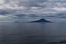 Matua and Rasshua Islands as seen entering the Golovnin Strait. Matua is in the foreground and Rasshua in the background.