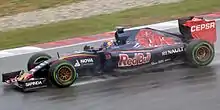 A picture of Max Verstappen driving a Toro Rosso TR10 during the 2015 Malaysian Grand Prix.