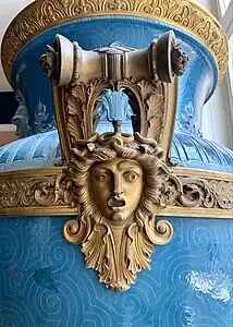 Neoclassical Medusa mascaron with acanthuses on a handle of the Mayeux Vase, by the Sèvres Porcelain Manufactory, 1878, hard-paste porcelain, gilded copper molding on the collar, and gilded bronze handles, Louvre