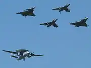 Two Super Étendard, two Rafale fighters and an E-2C Hawkeye at the 2010s French Naval Aviation Centenary Airshow