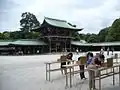 Women signing prayers in main courtyard