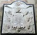 Monument to Emily, the wife of Admiral Charles Lister Oxley in Ripon Cathedral. The angelic heads depict the couple and their seven children (1898).