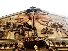 Pediment featuring St. Christopher carrying Child Jesus on his back