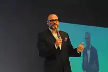 Michael Palance speaking at a conference