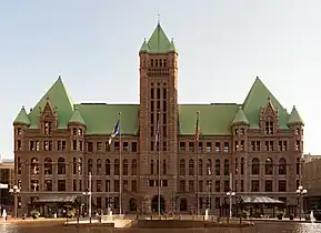 The station's design preserves the view of Minneapolis City Hall, an ornate Richardsonian Romanesque design.