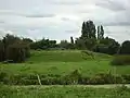 The castle mound in the hamlet of Vaux.