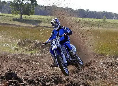 Image 22MotocrossCredit: Fir0002Motocross is form of motorcycle or ATV racing held on enclosed off-road circuits. The tracks are often quite large, natural, terrains with very few man made jumps, unlike Supercross, a sport that was originally derived from Motocross and is executed on a smaller track with many more extreme man made obstacles.More selected pictures