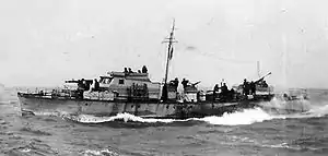 Motor Gun Boat moving left to right at sea