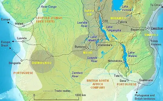 South-central Africa in 1880 showing the central position of Msiri’s Kingdom and the principal trade routes, with the approximate territories of Msiri’s main allies (names in yellow) and the European powers (names in orange) before borders were settled by the Berlin Conference. The east coast trade was controlled by the Sultan of Zanzibar. Areas of influence of other tribes and of France and Germany not shown