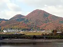 The double peaks of Mount Nijō