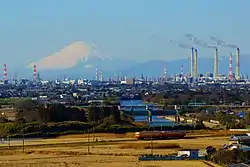 The Keiyō Industrial Zone, one of Japan's largest industrial complexes that spans the eight cities of Chiba Prefecture, and Mount Fuji on the horizon