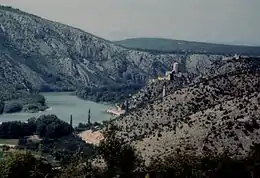 Lower Neretva Valley - pictured from behind the walls of Počitelj, looking north and upstream towards Počitelj village and its Citadel, and further behind Mostar