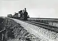 A locomotive of the series 7100 of the N.S. with a train between Hantum and Ternaard. (26-04-1935)