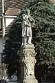 A statue in front of the castle