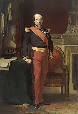 Napoleon III in his early fifties, posing for a portrait in his Grand Cabinet.