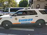 Nassau County Corrections Ford Explorer striped orange & blue.