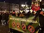 A pro-migration demonstration in Helsinki, Finland, showing a sign saying Natsit & ISIS = samaa paskaa, Finnish for "Nazis & ISIS = the same shit".