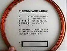 Nb/Cu-7.5at%Sn-0.4at%Ti tape (9.5×1.8 mm cross section) originally developed for an 18.1 T magnet. Nb core: 361×348 packs of 5 µm dia. filaments. Critical current 1700 A (16 tesla, 4.2 K), critical current density 20 kA/cm2