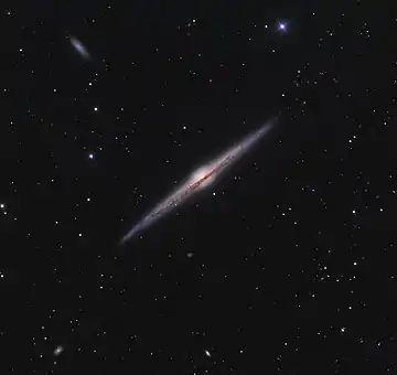 Image 10Needle GalaxyPhotograph: Ken CrawfordNGC 4565 (also known as the Needle Galaxy) is an edge-on spiral galaxy about 30 to 50 million light-years away in the constellation Coma Berenices. NGC 4565 is a giant spiral galaxy more luminous than the Andromeda Galaxy, and has a population of roughly 240 globular clusters, more than the Milky Way.More selected pictures