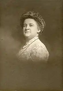 Portrait of a white woman with a bouffant hairdo