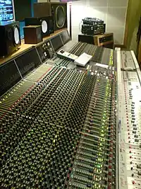 Image 1Neve VR60, a multitrack mixing console. Above the console are a range of studio monitor speakers. (from Recording studio)