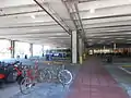 Bicycles and buses at the station.