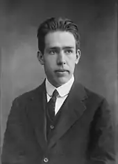 Head and shoulders of young man in a suit and tie