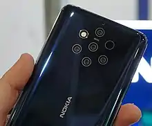 Image 58The back of a Nokia 9 PureView. It features a five-lens camera array with Zeiss optics, using a mixture of color and monochrome sensors. (from Smartphone)