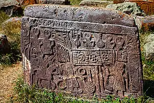 Tombstone depicting a wedding celebration.