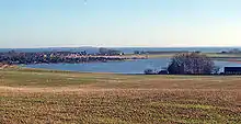 Norsminde Fjord viewed towards the Bay of Aarhus, with the village of Norsminde at the seaside.