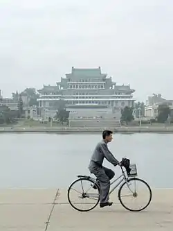 The Grand People's Study House on the bank of the river.