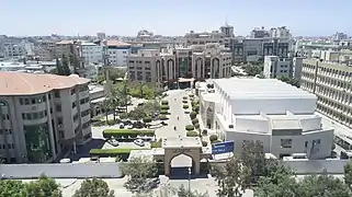 The conference hall (right) and the continuous education building (left) can be seen.