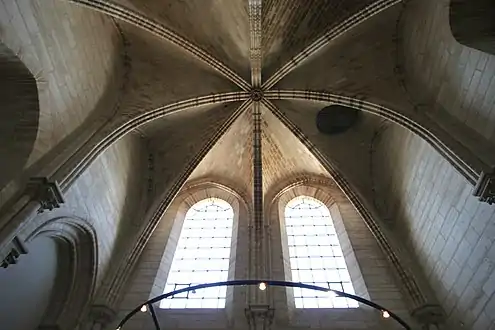 Circular utility door (right of center) in the ceiling below the north tower made for raising and lowering bells