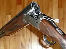 Shotgun with empty barrels swivelled open