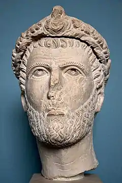 Head of a ruler. Head of a man wearing a wreath