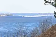 View of snow geese on the river from the village