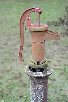 Old hand water pump (c. 1924) at the Colored School in Alapaha, Georgia, US; typical of the period and the area