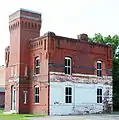 Side of the building (a one-story building once adjoined it)