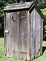 Outhouse replica on the grounds