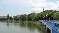 Panorama of the bridge on the lake