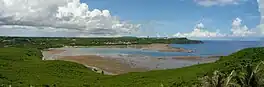 River water wends through the reef flats of a tropical bay