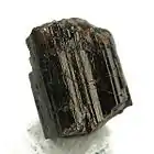 Striated, euhedral painite crystal (size: 0.9×0.8×0.7 cm)