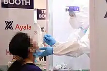 A person being swab test at Palacio de Maynila