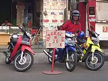 Image 31A ojek driver at the motorcycle taxi stand. (from Transport in Jakarta)