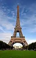 The Eiffel Tower in Paris, France, a popular tourist attraction. Almost 7 million visit the tower each year.[citation needed]