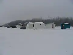 Ice fishing cabins, Batiscan River's mouth, Quebec, Canada