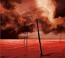 Red clouds over a red sea with poles jutting from it