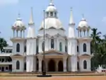 Front of white, domed church